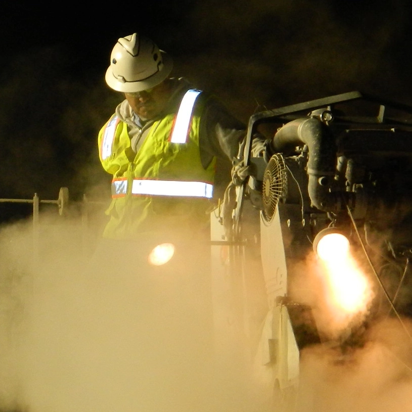 working cutting concrete at night