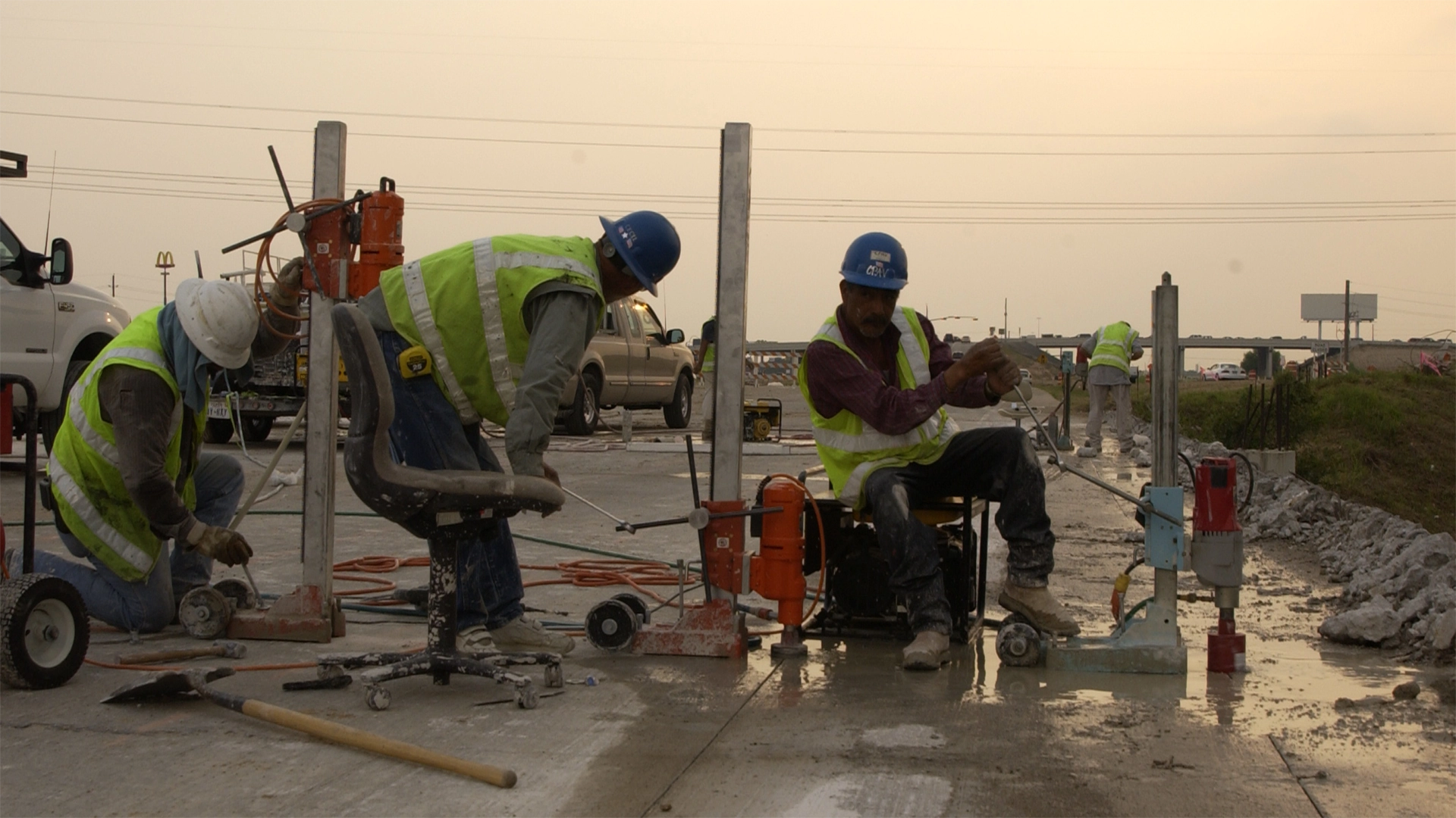 Workers drilling cores in concrete